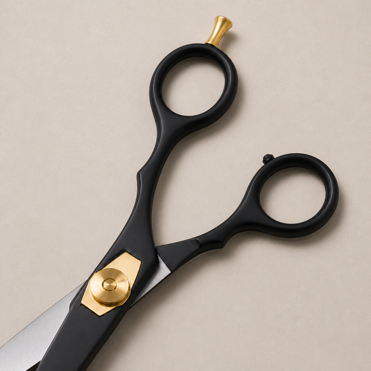 Close view of the black blades, gold pivot and finger rest on Diggn'It scissors