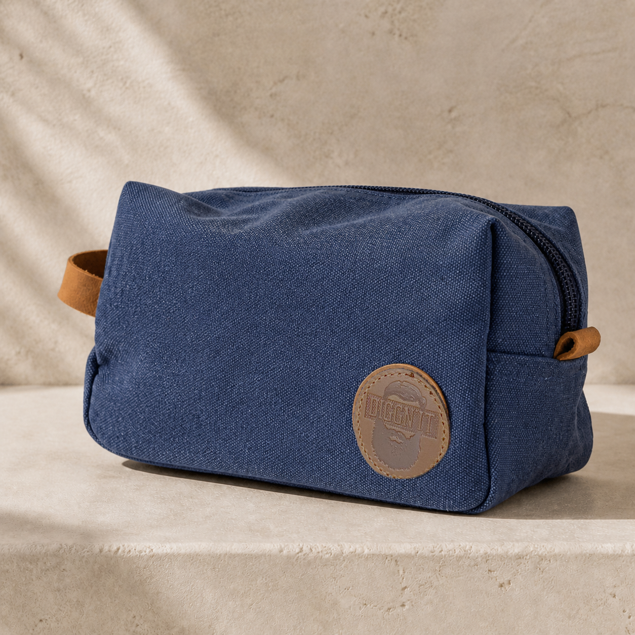Diggn'It Men's Travel Bag in Denim on warm mineral plaster
