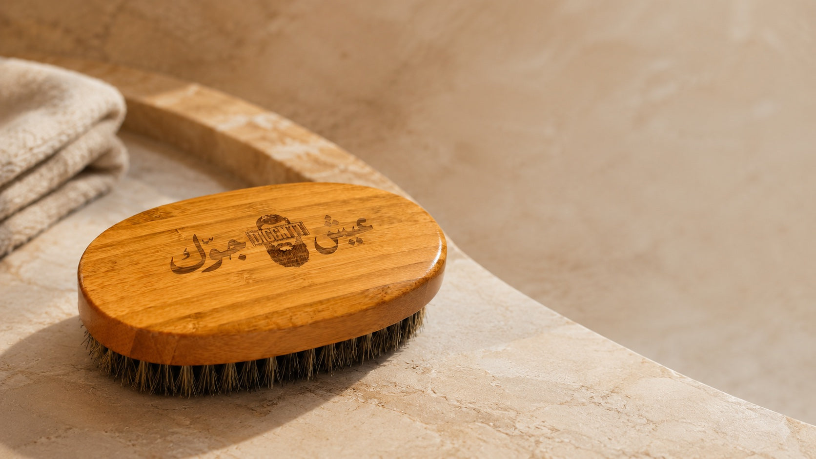DiggnIt bamboo beard brush on a warm stone surface