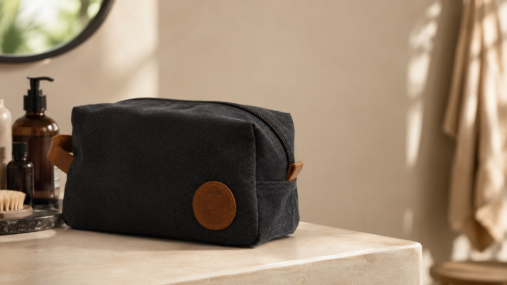 DiggnIt mens travel toiletry bag on a warm bathroom counter