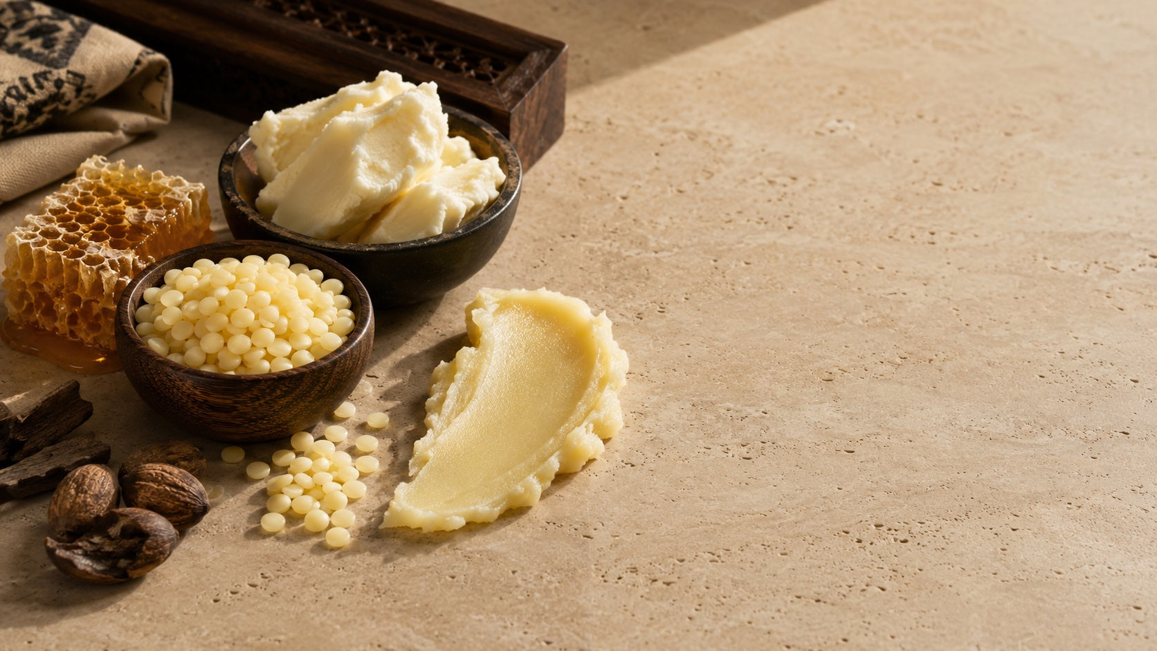 Beeswax, honeycomb, shea butter, and firm wax texture on stone