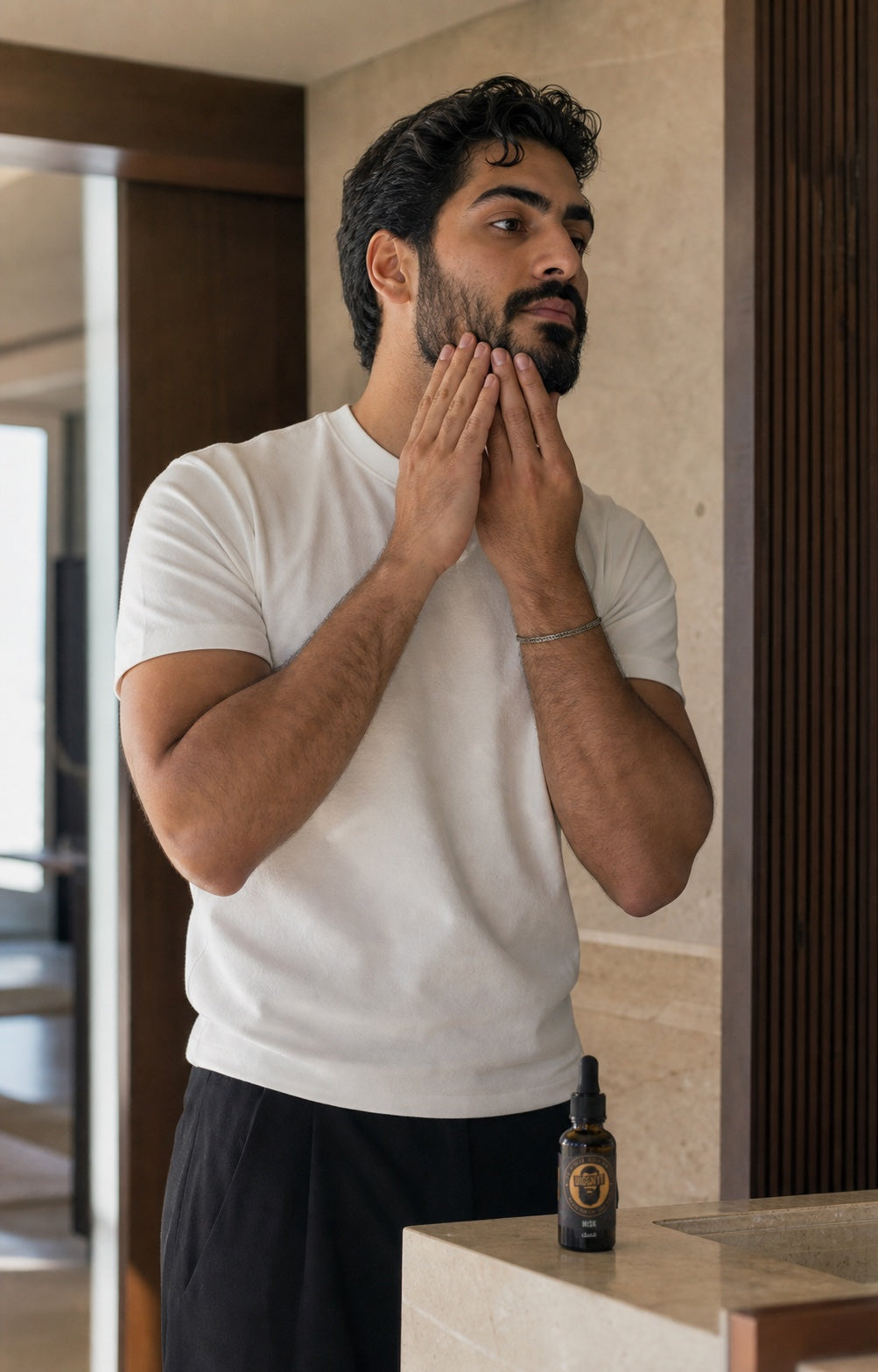 A man applying Misk Arabian Beard Oil as part of his morning routine